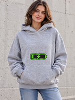 Female model wearing a grey Social Battery Recharging women's hoodie, front view