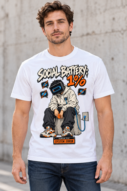 Male model wearing a white Social Battery 1% graphic T-shirt with low-battery screen-headed character and blue charging cable.