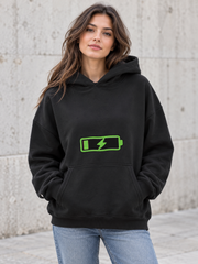 Female model wearing a black Social Battery Recharging women's hoodie, front view