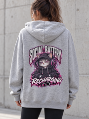 Female model wearing a grey Social Battery Recharging women's hoodie, back view