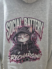 Close-up of Social Battery Recharging cat and headphones back print